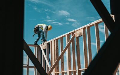 construction worker in hard hat on building frame